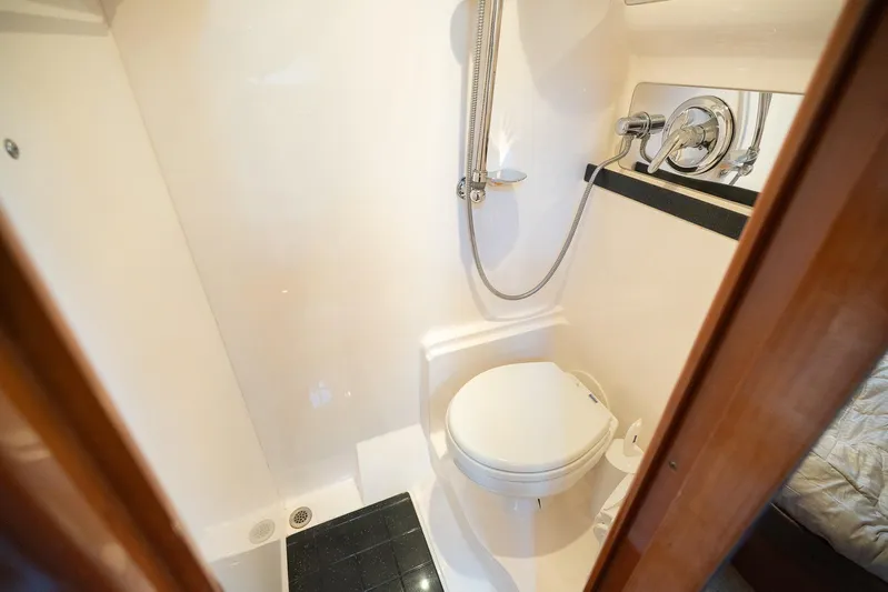  Yacht Photos Pics Compact bathroom in 2009 Regal Commodore 4060 yacht with shower and toilet.