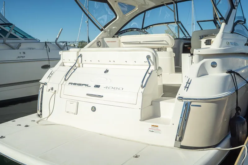  Yacht Photos Pics 2009 Regal Commodore 4060 yacht docked, showcasing sleek design and spacious deck.