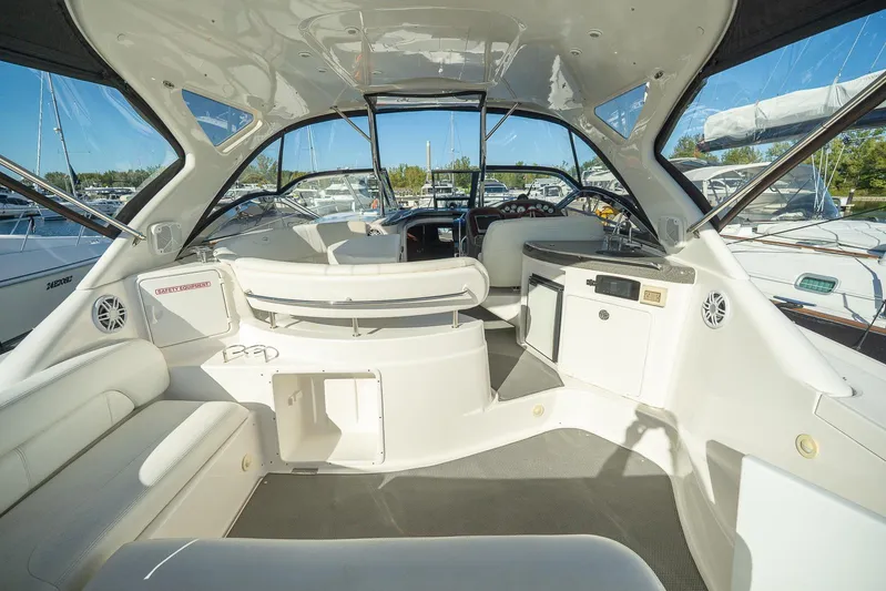  Yacht Photos Pics 2009 Regal Commodore 4060 yacht interior with seating and helm, docked at marina.