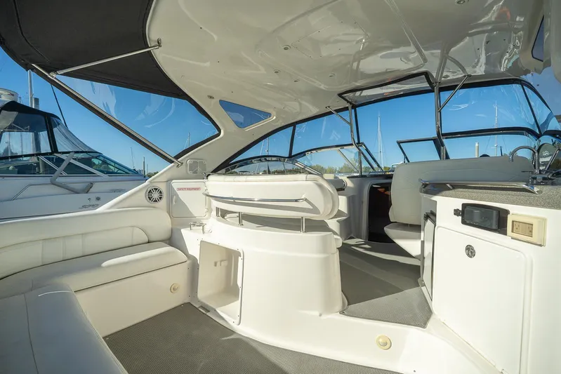  Yacht Photos Pics 2009 Regal Commodore 4060 yacht interior with white seating and modern dashboard.