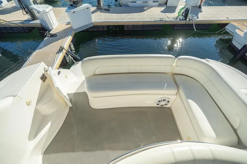  Yacht Photos Pics 2009 Regal Commodore 4060 boat interior with white seating, docked at marina.