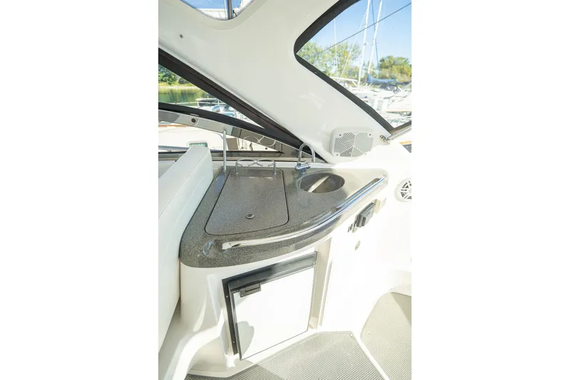  Yacht Photos Pics 2009 Regal Commodore 4060 yacht interior with kitchenette and sink.