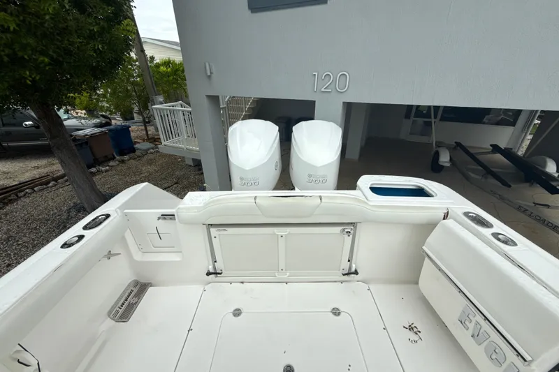  Yacht Photos Pics 2016 Everglades 295 Center Console boat with dual Yamaha 300 engines, parked near a house.