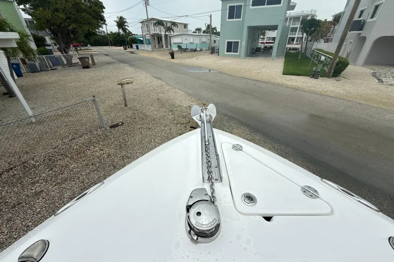 Yacht Photos Pics Bow of 2016 Everglades 295 Center Console boat with anchor chain, residential street view.