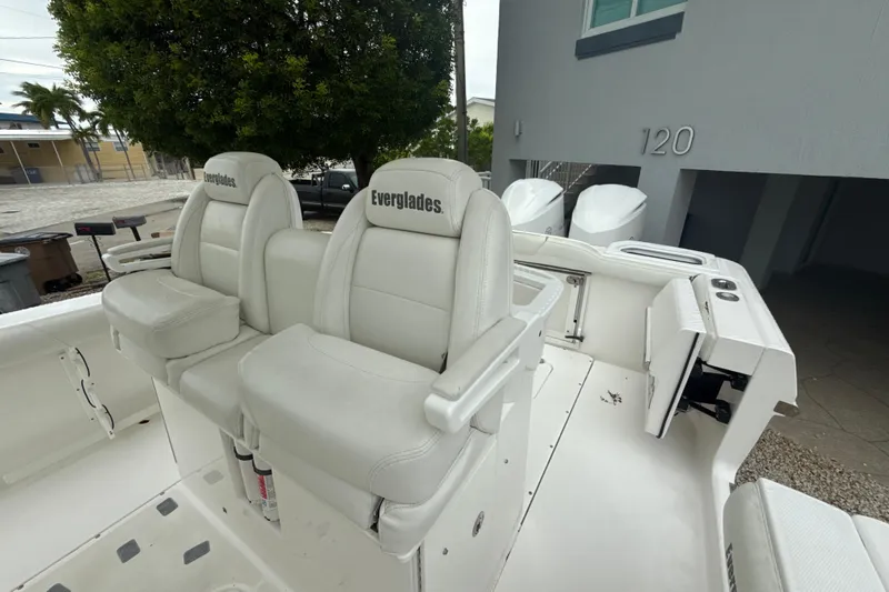  Yacht Photos Pics 2016 Everglades 295 Center Console boat with white seating and dual engines.