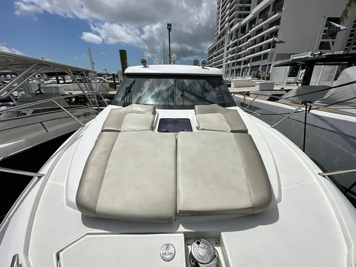 Andalucia Yacht Photos Pics 2017 Jeanneau NC 11 yacht with sunbathing cushions docked at marina.