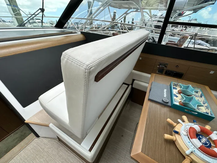 Andalucia Yacht Photos Pics Interior of 2017 Jeanneau NC 11 yacht with seating and nautical decor.