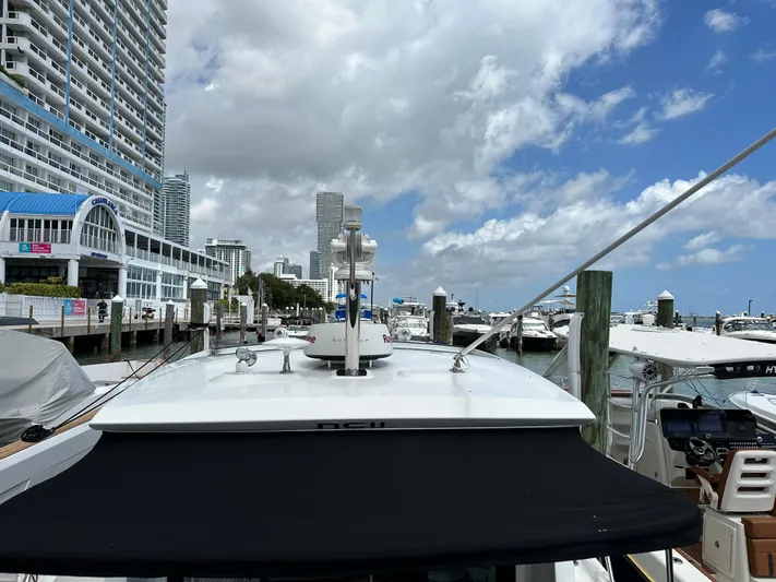 Andalucia Yacht Photos Pics 2017 Jeanneau NC 11 docked at a marina with cityscape background.