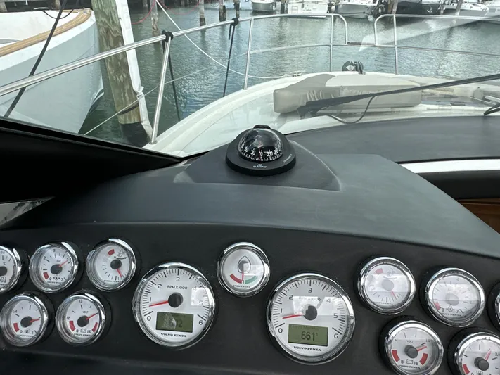 Andalucia Yacht Photos Pics Dashboard of a 2017 Jeanneau NC 11 boat with gauges and compass.