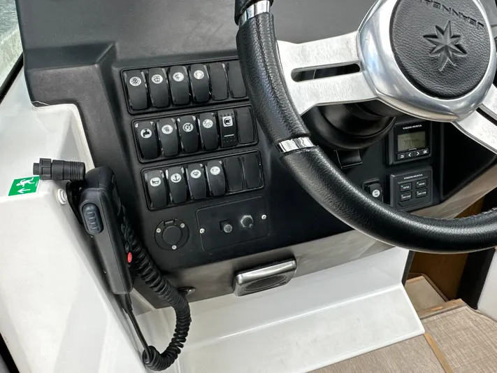 Andalucia Yacht Photos Pics Control panel and steering wheel of a 2017 Jeanneau NC 11 boat.