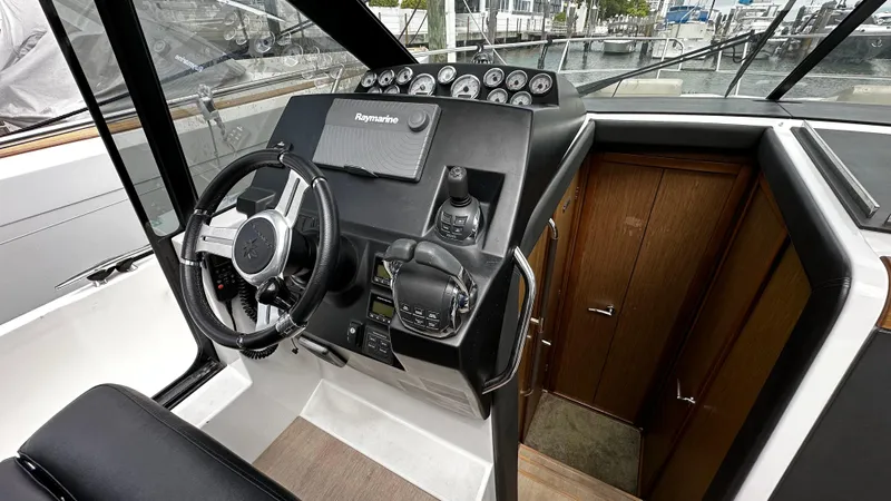 Andalucia Yacht Photos Pics 2017 Jeanneau NC 11 helm with modern controls and navigation equipment.