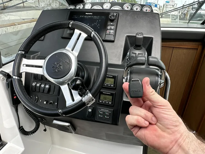 Andalucia Yacht Photos Pics 2017 Jeanneau NC 11 helm with steering wheel and throttle controls.