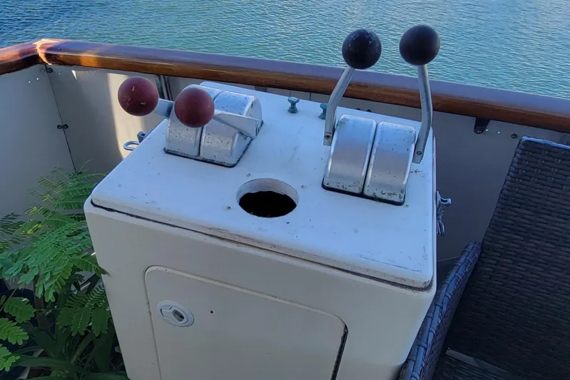 'elixir' Yacht Photos Pics Control panel on 1982 Hatteras 56 Wide Body yacht, overlooking water.