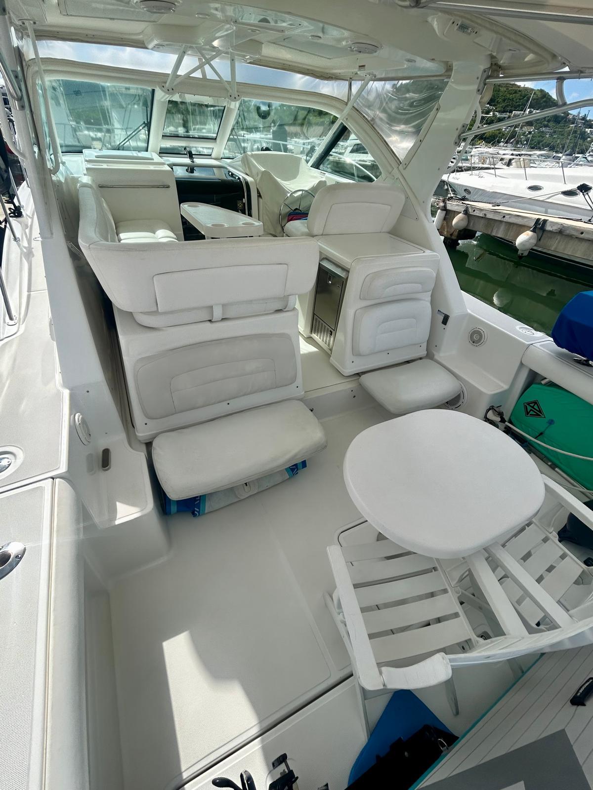 2007 Open TIARA 36 OPEN yacht interior with white seating and table.