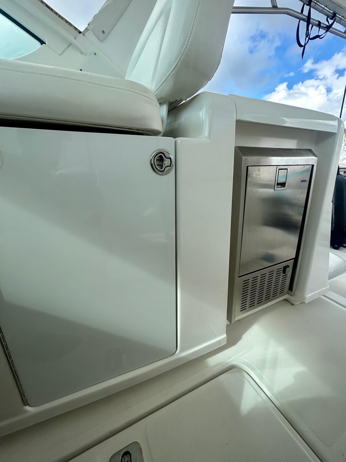 2007 TIARA 36 OPEN yacht interior with sleek cabinetry and stainless steel appliance.