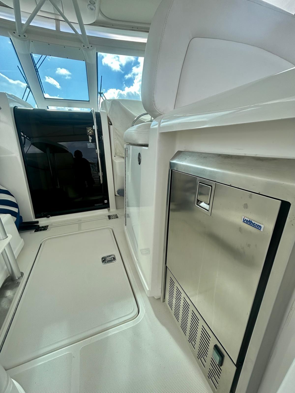 2007 TIARA 36 OPEN yacht interior with stainless steel appliances and bright natural lighting.