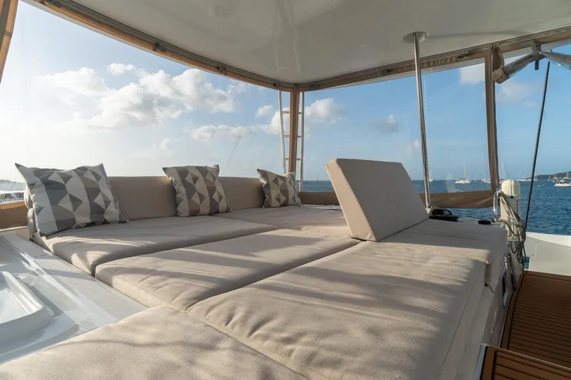 Altitude Adjustment Yacht Photos Pics Luxurious 2022 Lagoon 46 yacht with spacious sunbathing area and scenic ocean view.