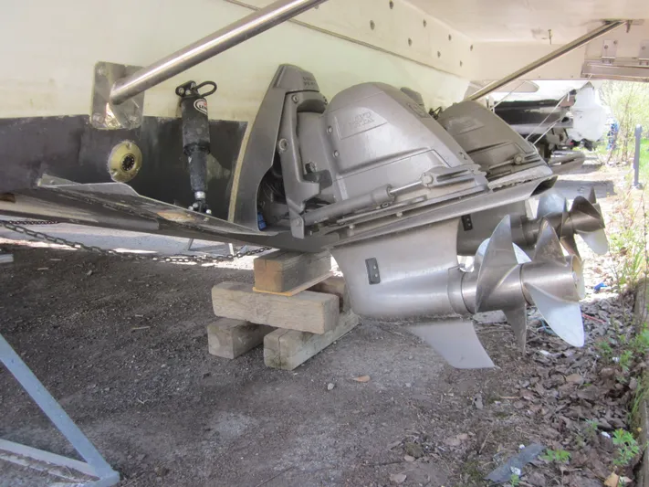  Yacht Photos Pics 2019 Jeanneau NC 33 boat propellers and stern drive on wooden blocks.