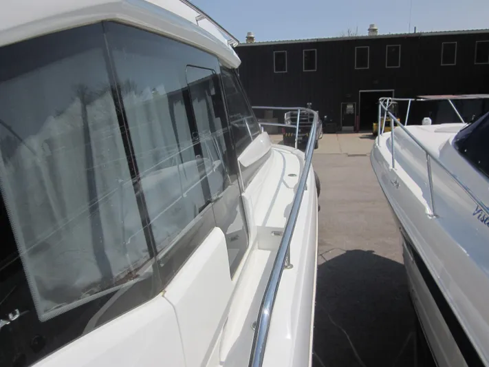  Yacht Photos Pics 2019 Jeanneau NC 33 boat docked, showcasing sleek design and modern features.