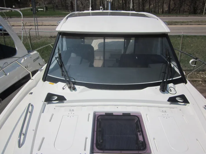  Yacht Photos Pics 2019 Jeanneau NC 33 boat with sleek windshield and deck view.