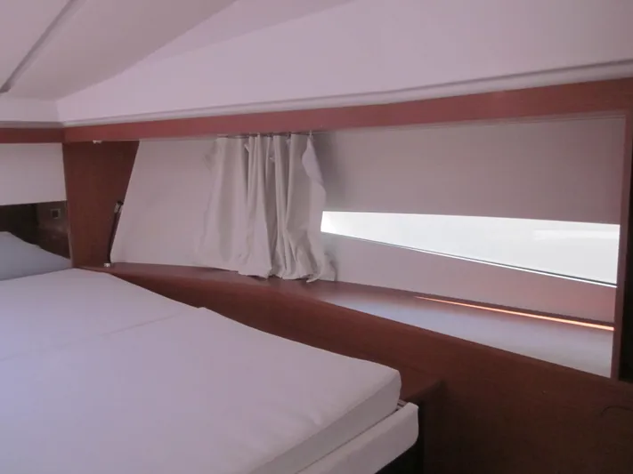  Yacht Photos Pics Interior cabin of 2019 Jeanneau NC 33 yacht with modern design and large window.