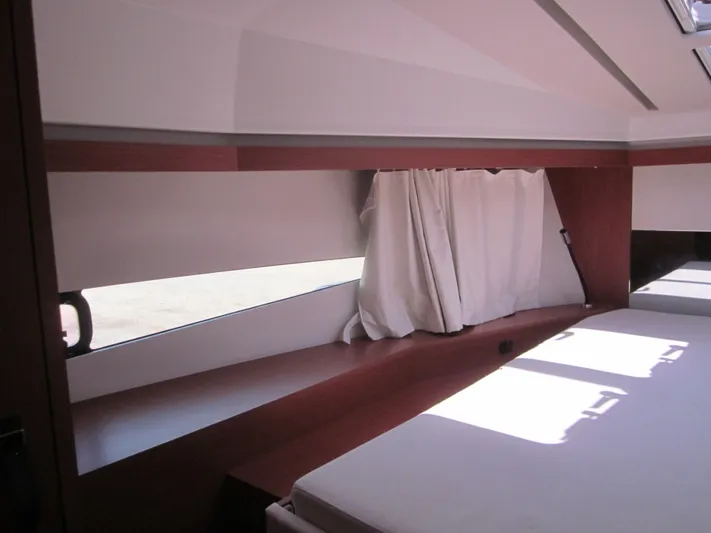  Yacht Photos Pics Interior cabin of 2019 Jeanneau NC 33 yacht with modern design and natural light.