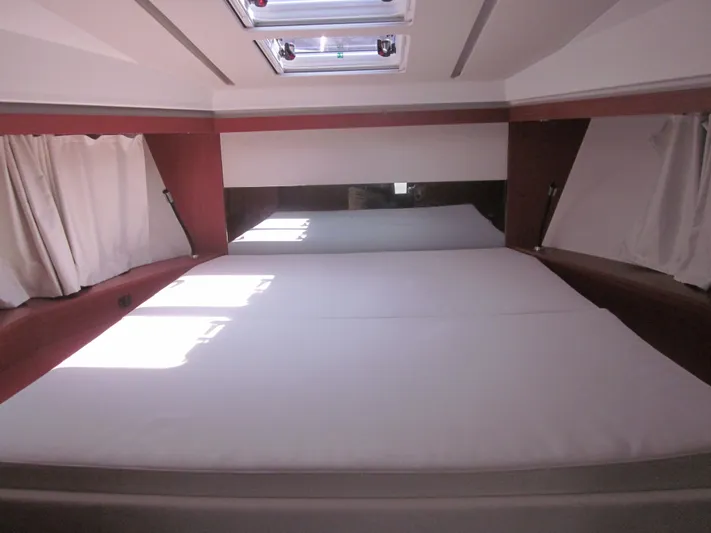  Yacht Photos Pics Interior cabin of 2019 Jeanneau NC 33 with skylight and curtains.