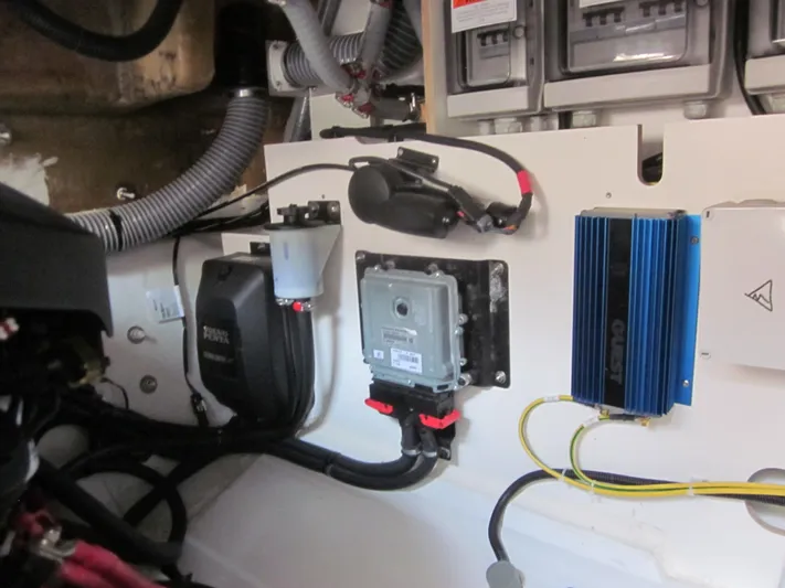  Yacht Photos Pics Engine compartment of a 2019 Jeanneau NC 33 boat, showcasing electrical components and wiring.