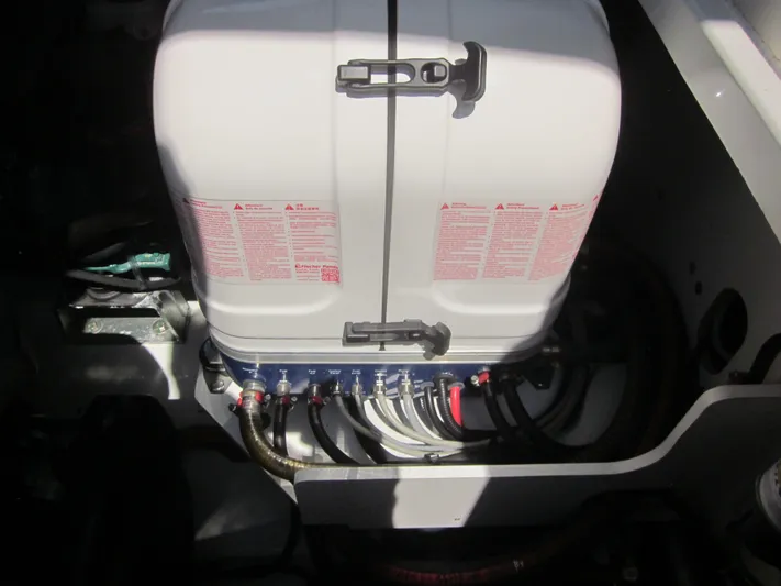  Yacht Photos Pics Engine compartment of a 2019 Jeanneau NC 33 boat, featuring a white engine cover.