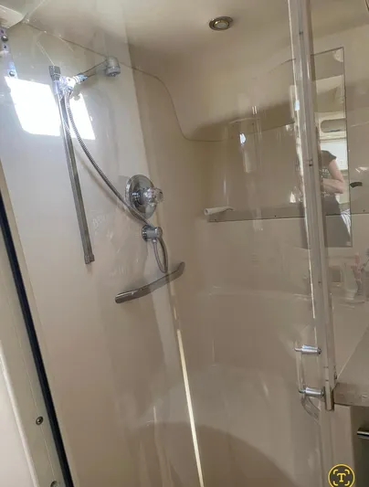  Yacht Photos Pics Shower area in 1998 Sea Ray 400 Sundancer yacht, featuring modern fixtures and glass door.