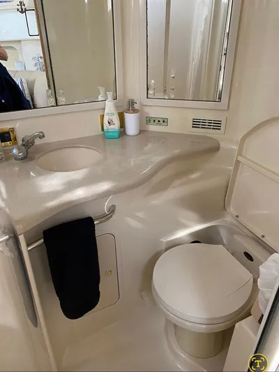  Yacht Photos Pics 1998 Sea Ray 400 Sundancer bathroom with sink, mirror, and toilet.