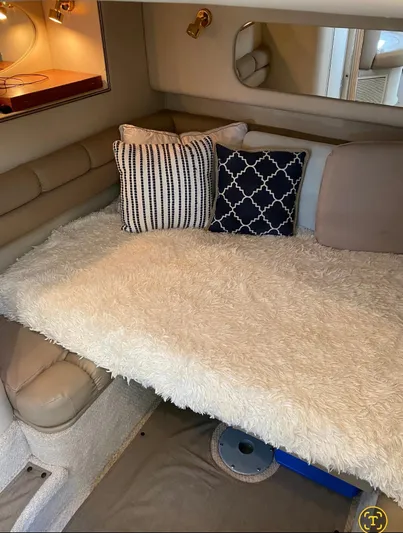  Yacht Photos Pics Cozy cabin interior of 1998 Sea Ray 400 Sundancer with plush bedding and decorative pillows.