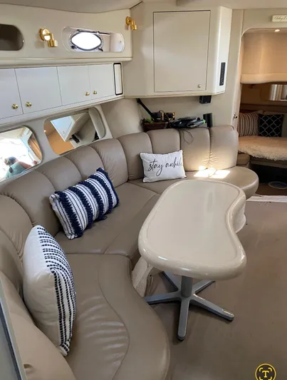 Yacht Photos Pics 1998 Sea Ray 400 Sundancer interior with beige leather seating and decorative pillows.