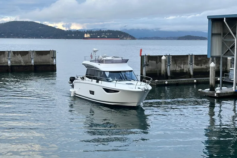  Yacht Photos Pics 2019 Jeanneau Velasco 37F yacht docked in a serene marina setting.