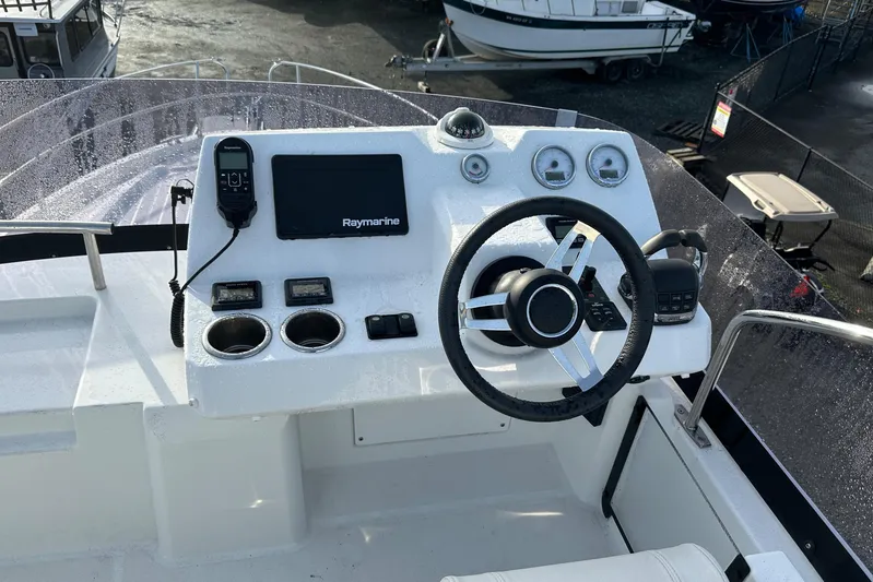  Yacht Photos Pics 2019 Jeanneau Velasco 37F helm with Raymarine electronics and steering wheel.