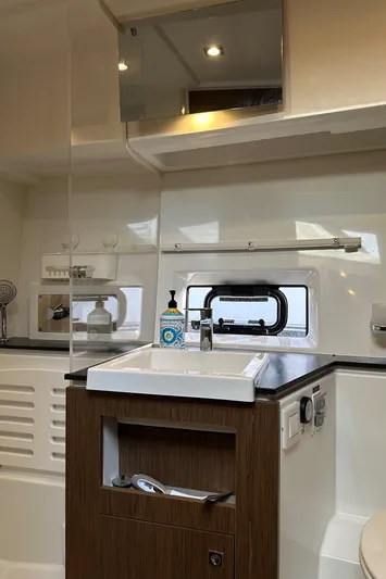  Yacht Photos Pics 2019 Jeanneau Velasco 37F yacht bathroom with modern sink and storage.