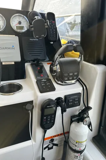  Yacht Photos Pics Control panel of 2019 Jeanneau Velasco 37F with navigation equipment and fire extinguisher.