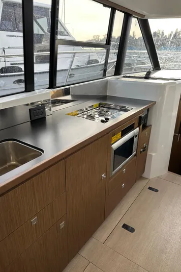  Yacht Photos Pics Modern kitchen interior of 2019 Jeanneau Velasco 37F yacht with sleek design.