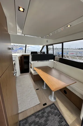  Yacht Photos Pics Interior of 2019 Jeanneau Velasco 37F yacht with modern seating and dining area.