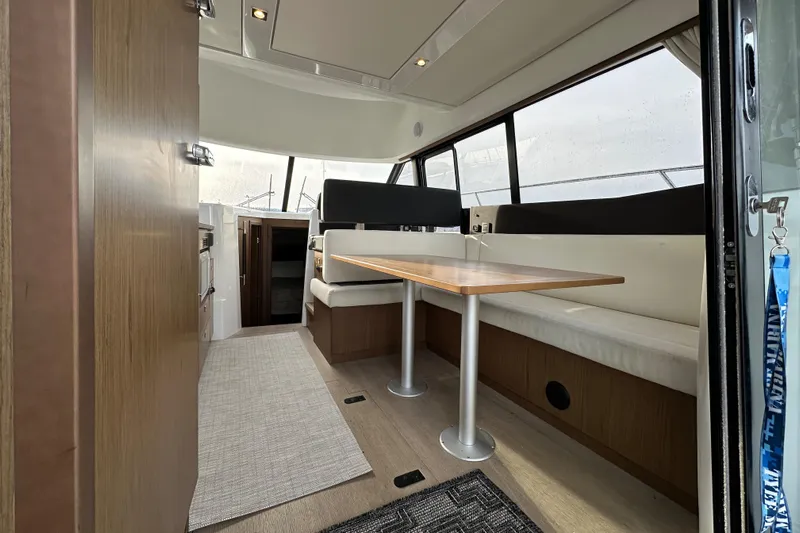  Yacht Photos Pics Interior of 2019 Jeanneau Velasco 37F yacht with modern seating and dining area.