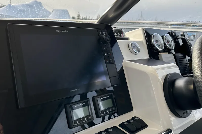  Yacht Photos Pics Jeanneau Velasco 37F 2019 helm with Raymarine navigation system and gauges.