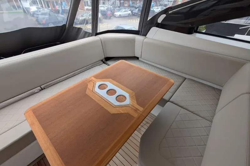 Tender Garage & Hi/lo Swimplatform Yacht Photos Pics Luxurious interior of 2022 Fairline Targa 45 GT yacht with elegant seating and wooden table.