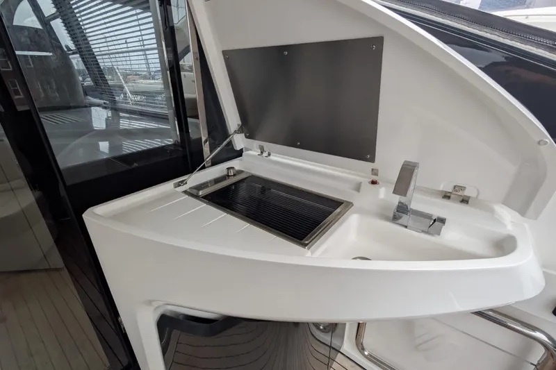 Tender Garage & Hi/lo Swimplatform Yacht Photos Pics Outdoor kitchenette on 2022 Fairline Targa 45 GT yacht with sink and grill.