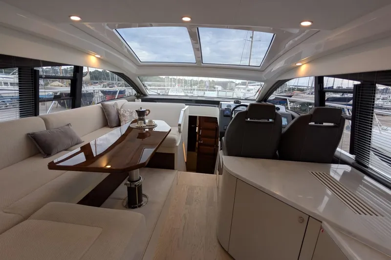 Tender Garage & Hi/lo Swimplatform Yacht Photos Pics Luxurious interior of 2022 Fairline Targa 45 GT yacht with elegant seating and panoramic windows.