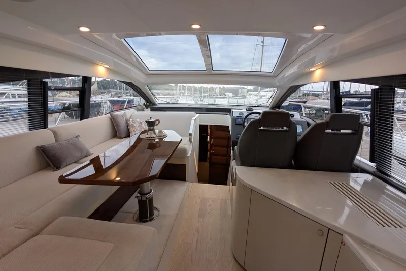 Tender Garage & Hi/lo Swimplatform Yacht Photos Pics Luxurious interior of 2022 Fairline Targa 45 GT yacht with elegant seating and panoramic windows.