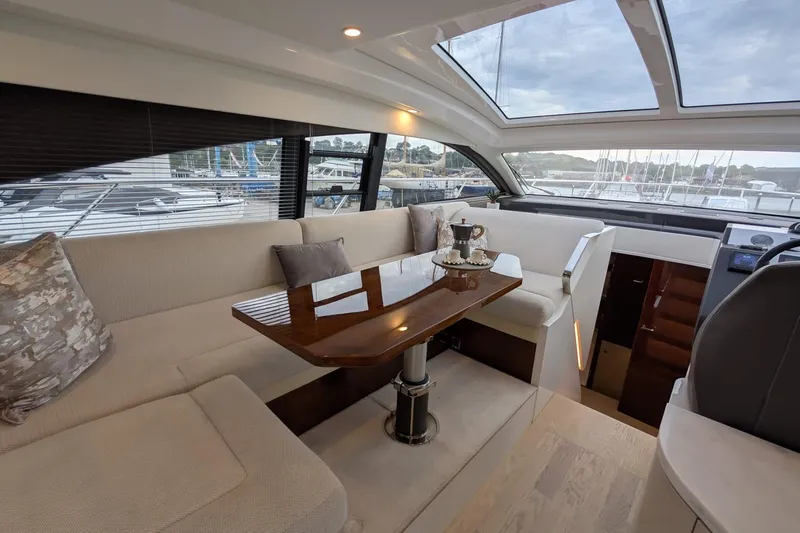 Tender Garage & Hi/lo Swimplatform Yacht Photos Pics Luxurious interior of 2022 Fairline Targa 45 GT yacht with elegant seating and panoramic windows.