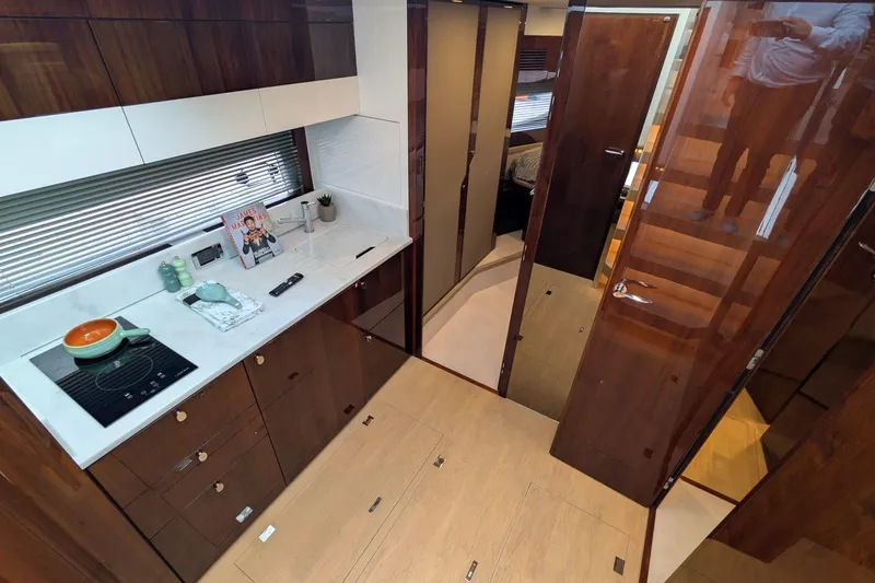 Tender Garage & Hi/lo Swimplatform Yacht Photos Pics Luxurious interior of 2022 Fairline Targa 45 GT yacht with modern kitchen design.