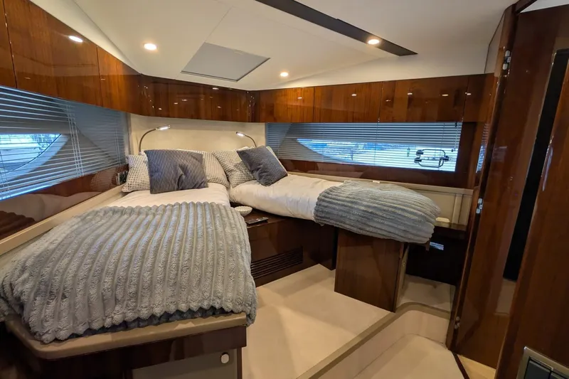 Tender Garage & Hi/lo Swimplatform Yacht Photos Pics Luxurious 2022 Fairline Targa 45 GT yacht cabin with twin beds and elegant wood finish.