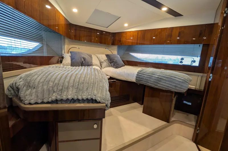 Tender Garage & Hi/lo Swimplatform Yacht Photos Pics Luxurious cabin interior of 2022 Fairline Targa 45 GT yacht with elegant bedding.