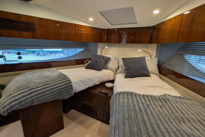Tender Garage & Hi/lo Swimplatform Yacht Photos Pics Luxurious 2022 Fairline Targa 45 GT cabin with twin beds and elegant wood paneling.